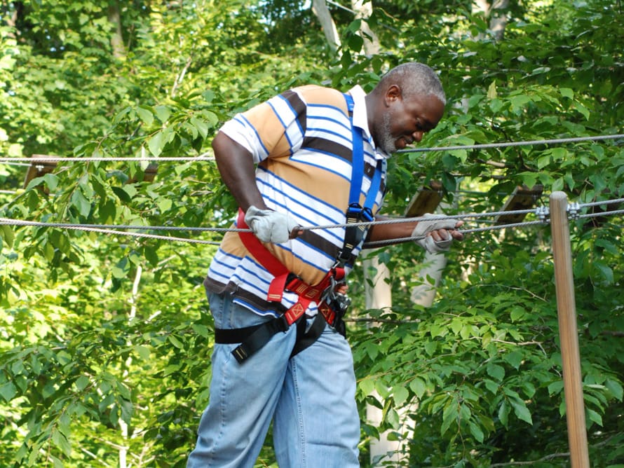 Man crossing ropes course