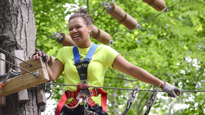 Woman on ropes course