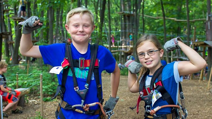 Two kids showing off their muscles