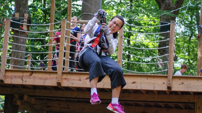 Woman smiling on zip line