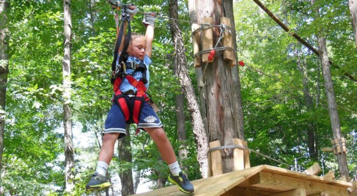Young boy on ropes course