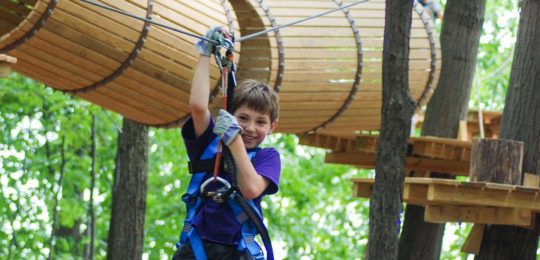 Young boy on zip line