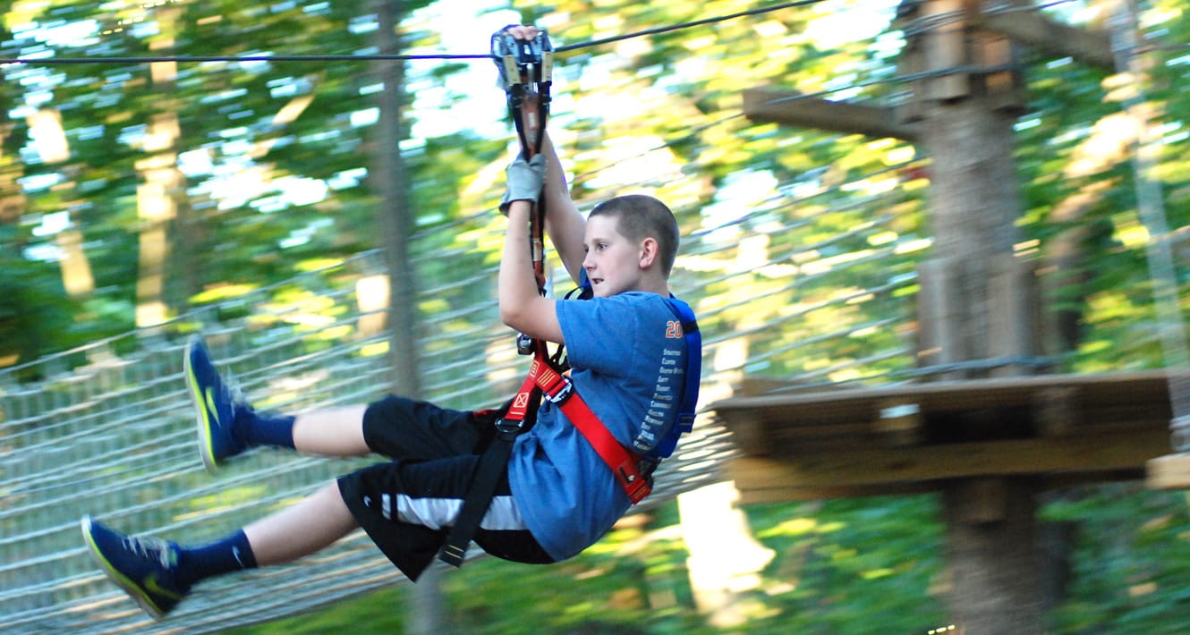 Boy on ropes course